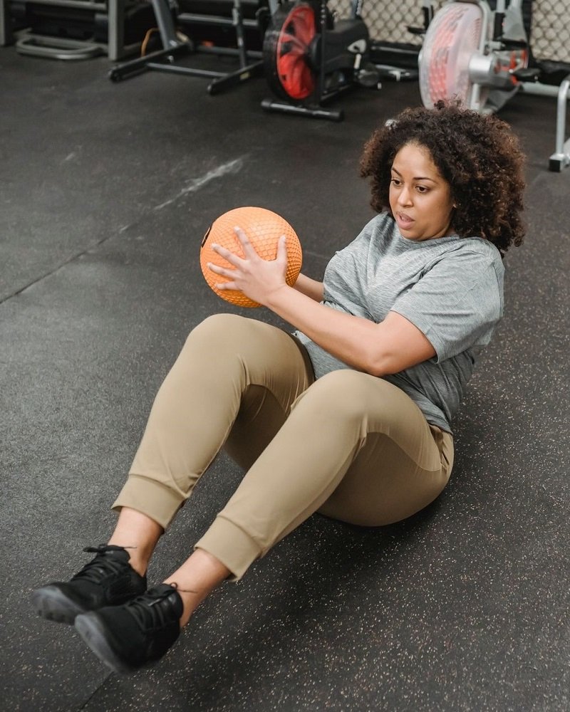 A confident mother celebrating her wellness progress